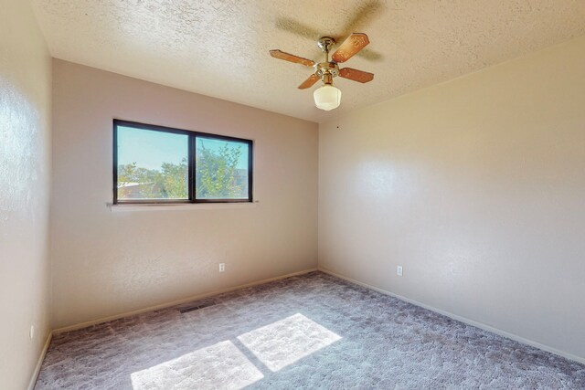 2709 Paseo De Tularosa, Santa Fe, NM 87505 - spare room with ceiling fan, a textured ceiling, and carpet floors