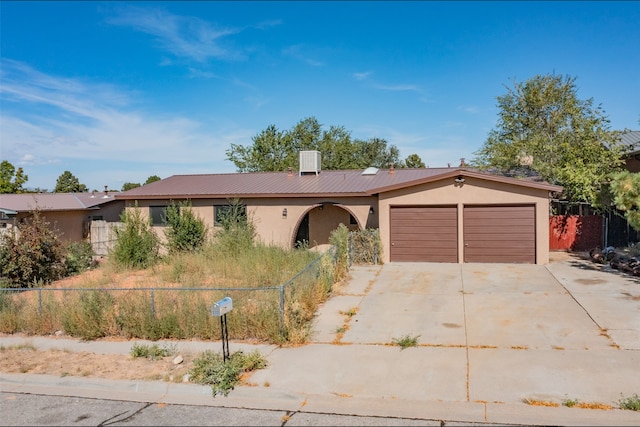 2709 Paseo De Tularosa, Santa Fe, NM 87505 - ranch-style house with a garage