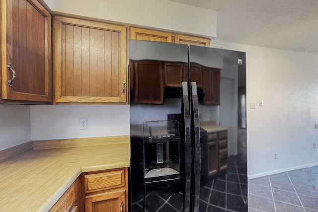 2709 Paseo De Tularosa, Santa Fe, NM 87505 - kitchen with dark tile patterned flooring