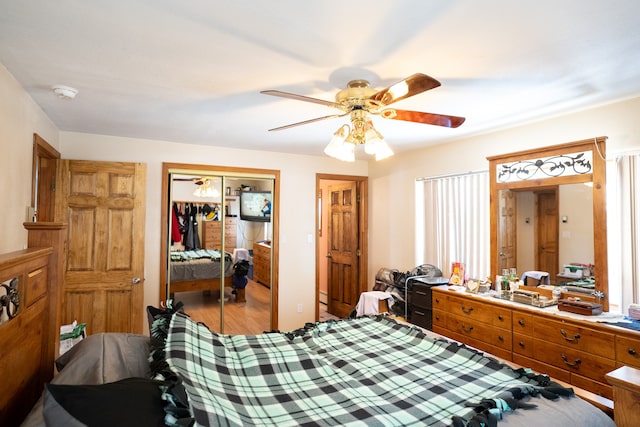 bedroom featuring hardwood / wood-style flooring and ceiling fan