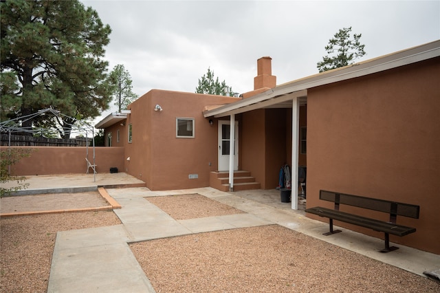 rear view of property featuring a patio