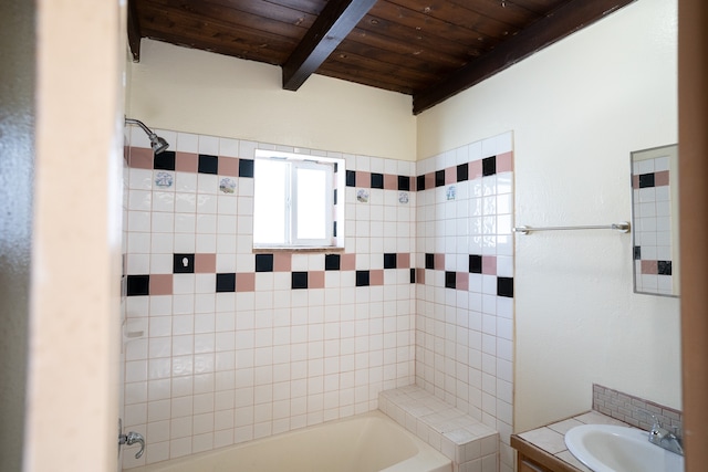 bathroom with wooden ceiling, beamed ceiling, vanity, and a bathing tub