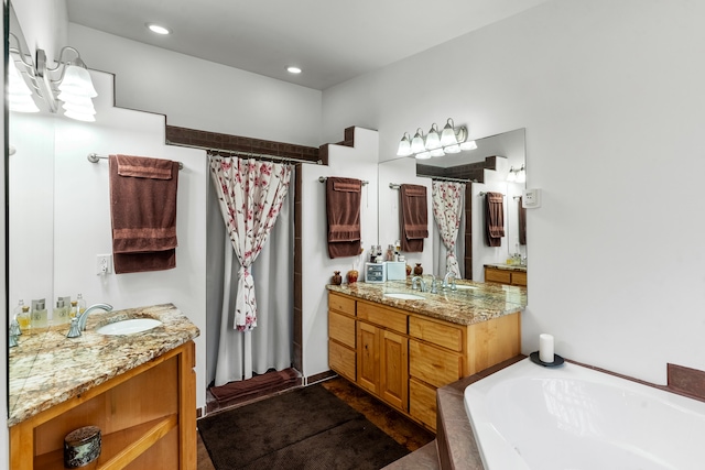 bathroom featuring plus walk in shower and vanity