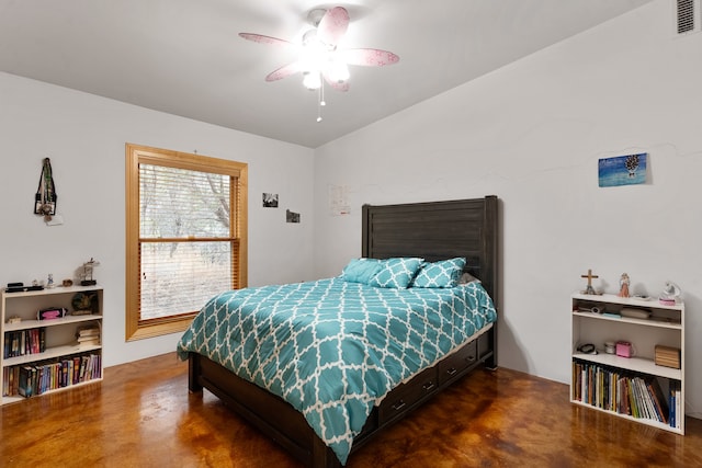 bedroom featuring ceiling fan and concrete floors