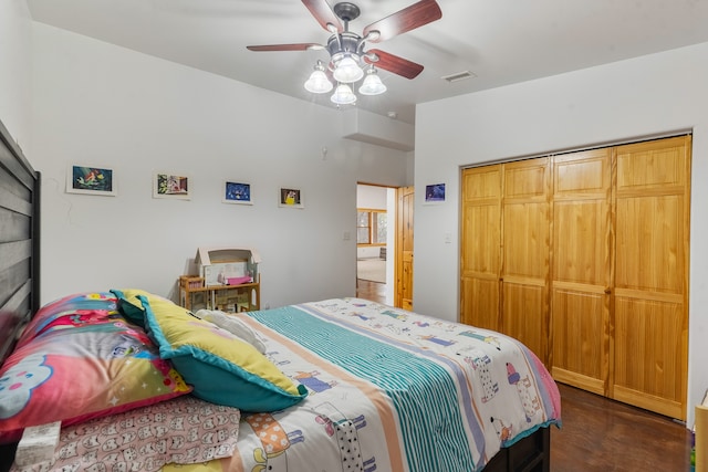 bedroom featuring ceiling fan and a closet