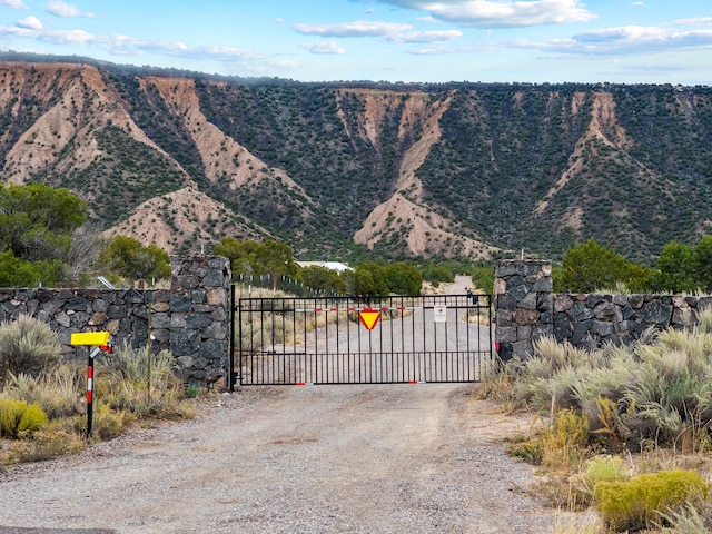 view of gate featuring a mountain view