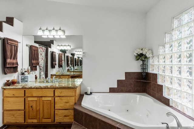 bathroom featuring vanity and separate shower and tub