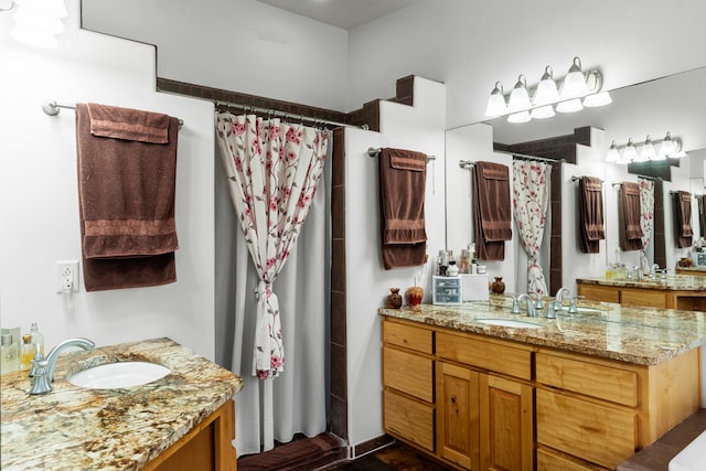 bathroom with a shower with curtain and vanity