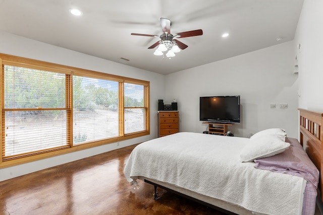 bedroom featuring concrete floors and ceiling fan