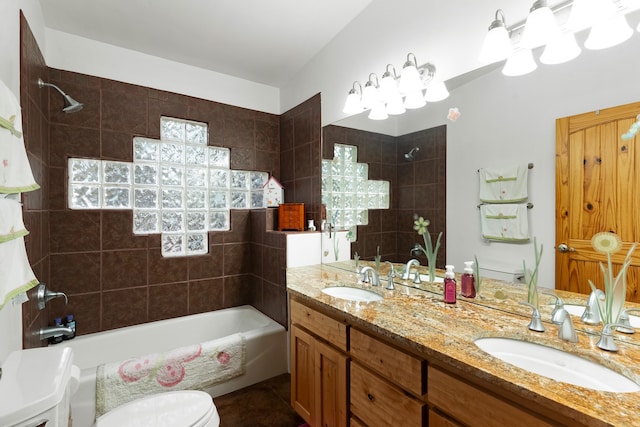 full bathroom with a healthy amount of sunlight, vanity, tiled shower / bath combo, and toilet