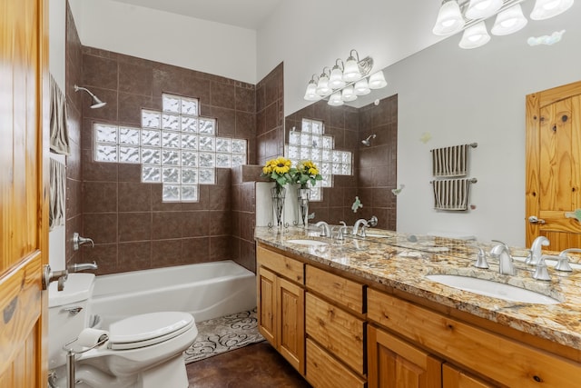 full bathroom with tile patterned floors, vanity, toilet, and tiled shower / bath combo