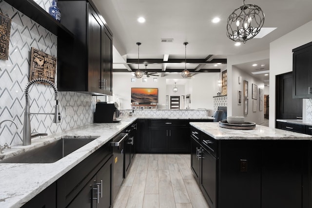 kitchen with a kitchen island, light wood-type flooring, pendant lighting, light stone countertops, and beamed ceiling