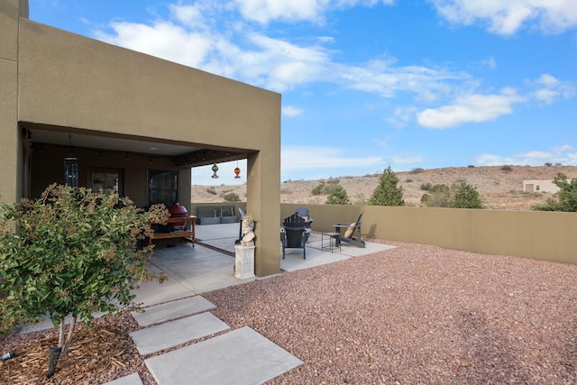 view of yard with a patio area and a mountain view