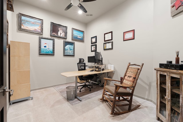 home office with light colored carpet and ceiling fan