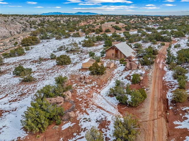 snowy aerial view featuring a mountain view