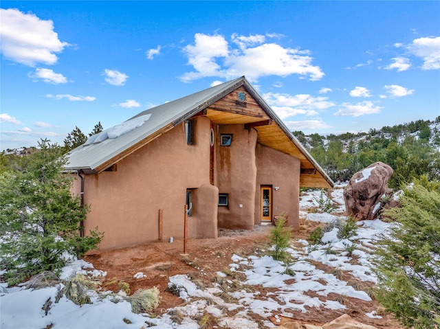 view of snow covered property