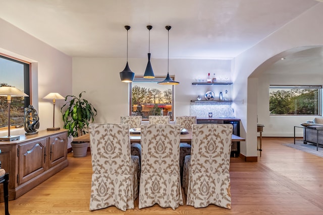 dining area featuring light wood-type flooring