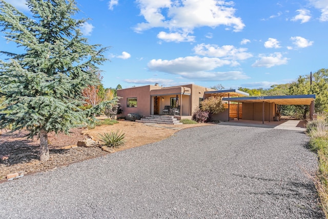 view of front of home with a carport