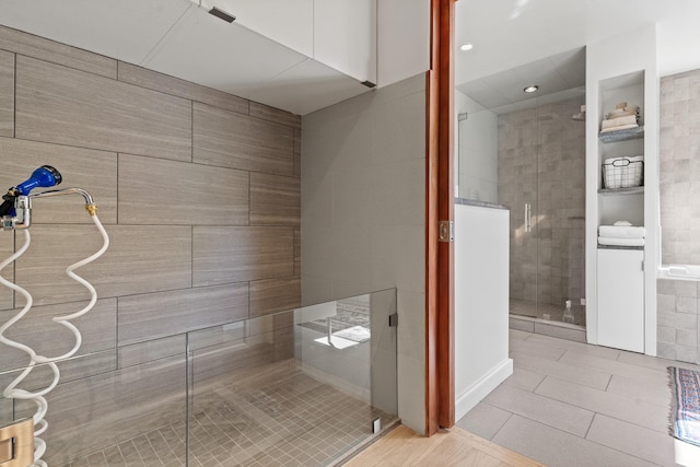 full bath with a tile shower