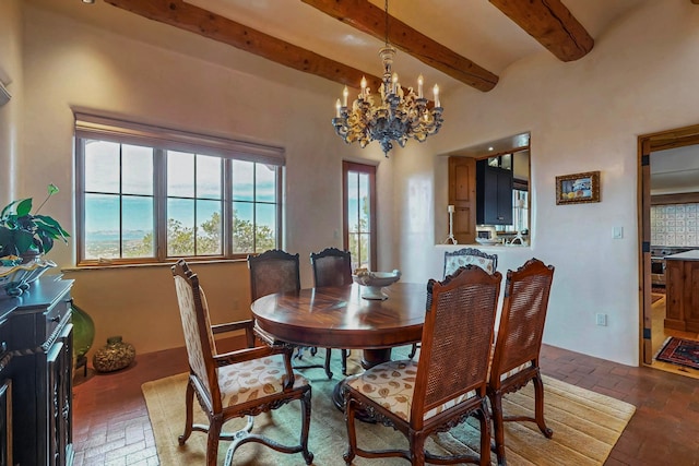 dining space featuring beamed ceiling and a notable chandelier