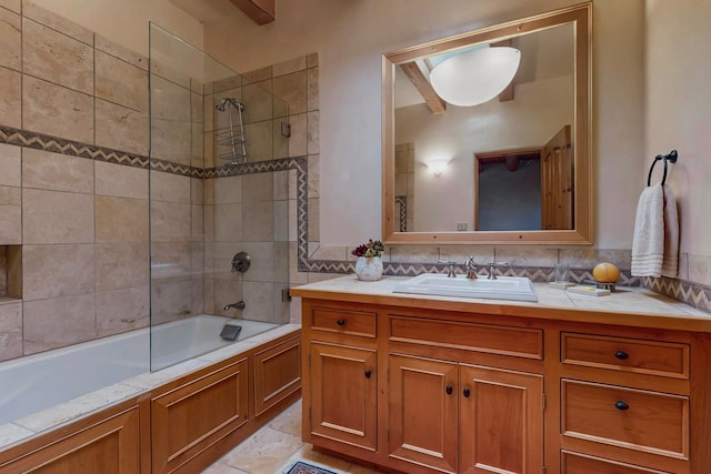 bathroom with vanity and tiled shower / bath combo