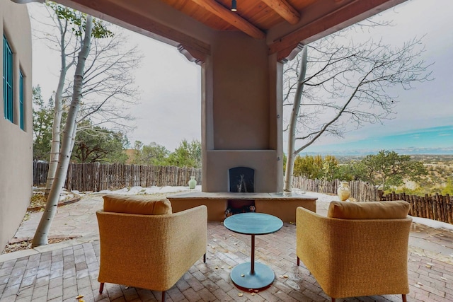 view of patio / terrace with an outdoor fireplace