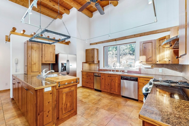 kitchen with appliances with stainless steel finishes, sink, exhaust hood, beam ceiling, and wooden ceiling