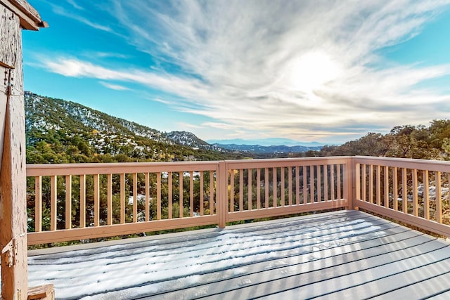 wooden terrace with a mountain view