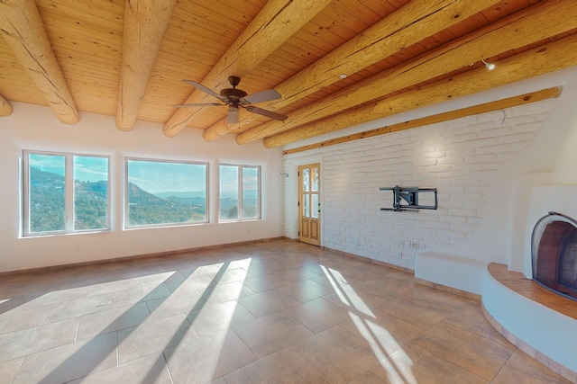 unfurnished living room with beamed ceiling, ceiling fan, wooden ceiling, and light tile patterned floors