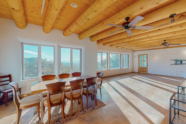 dining area with brick wall, ceiling fan, light tile patterned floors, wooden ceiling, and beamed ceiling