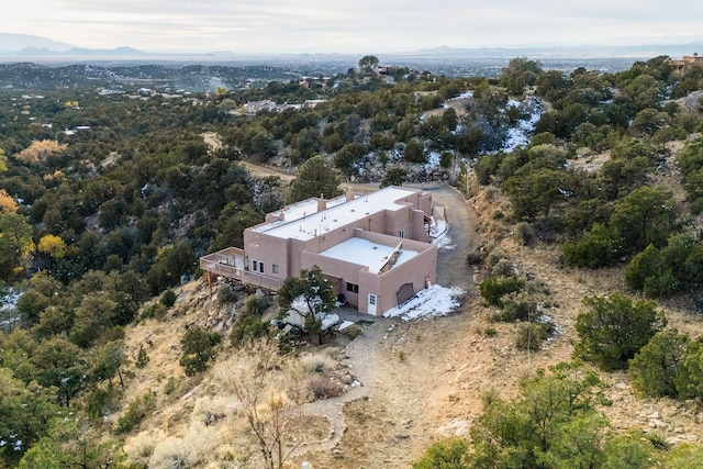 birds eye view of property featuring a mountain view