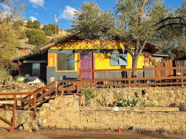 view of front facade featuring a wooden deck