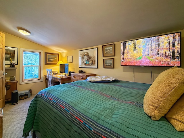 bedroom with carpet and vaulted ceiling