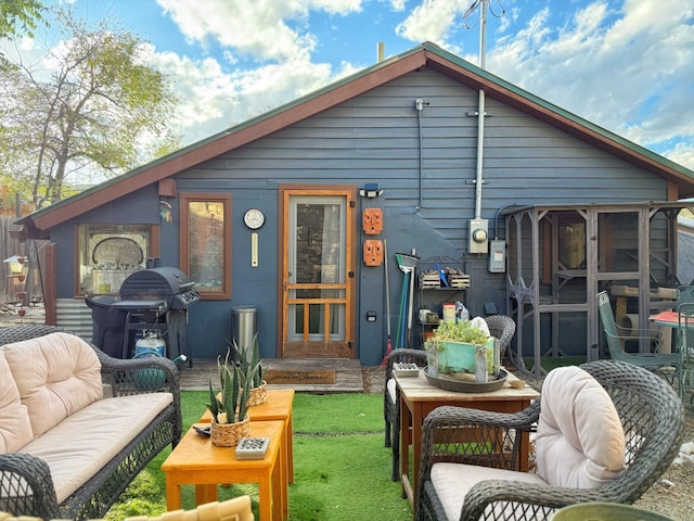 back of house featuring an outdoor hangout area