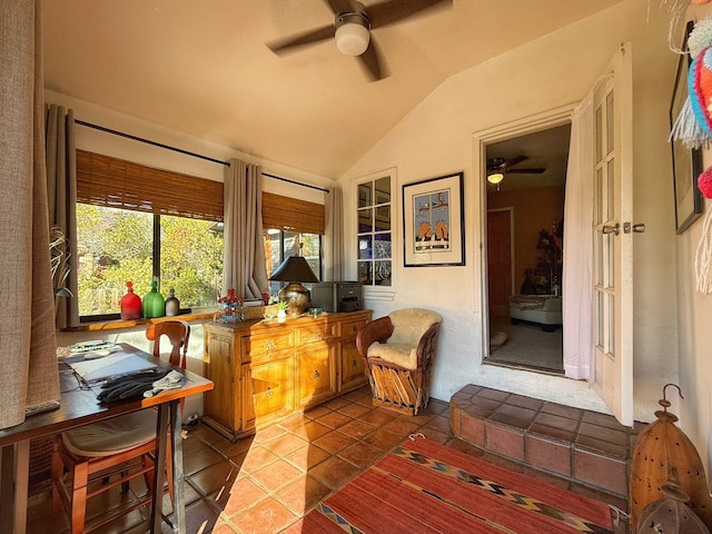 sunroom / solarium with ceiling fan and vaulted ceiling