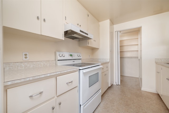 kitchen with white cabinetry and white electric stove