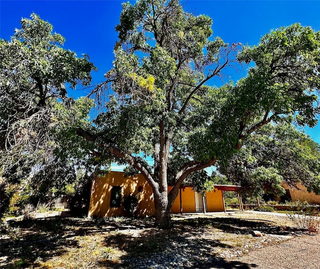 view of property exterior with a carport