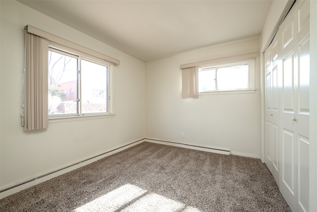 empty room featuring carpet flooring and plenty of natural light