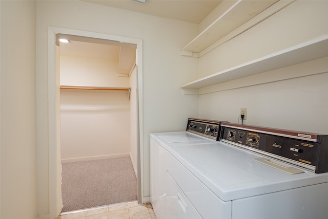 laundry area featuring light carpet and independent washer and dryer