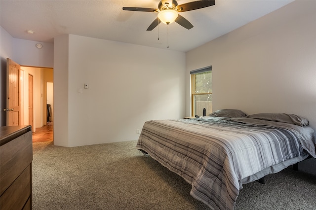 bedroom with ceiling fan and carpet floors