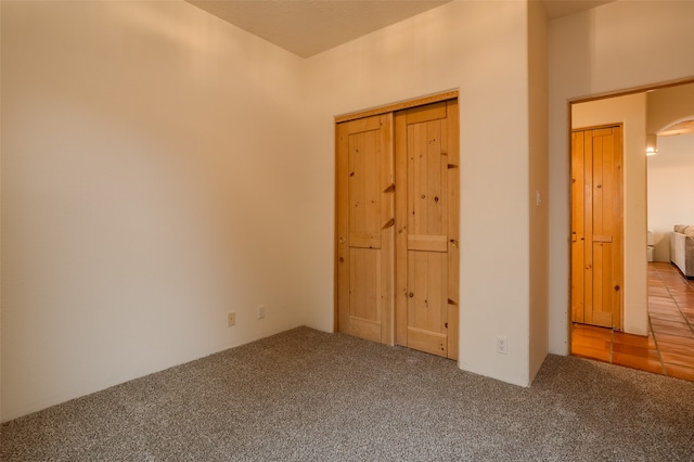 unfurnished bedroom featuring carpet