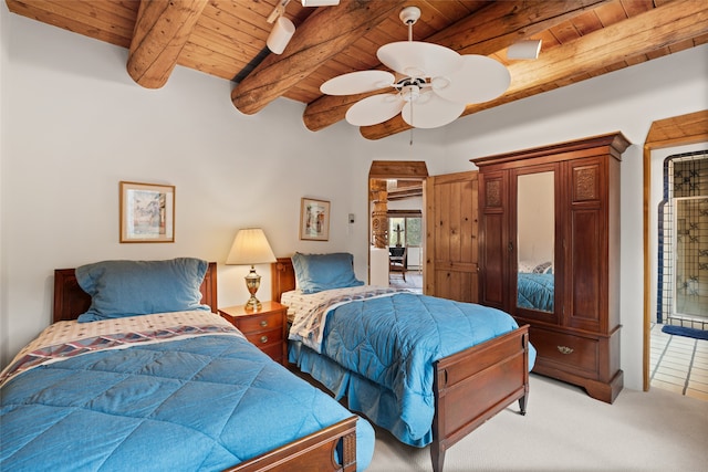 bedroom featuring beam ceiling, ceiling fan, wooden ceiling, and light tile patterned flooring