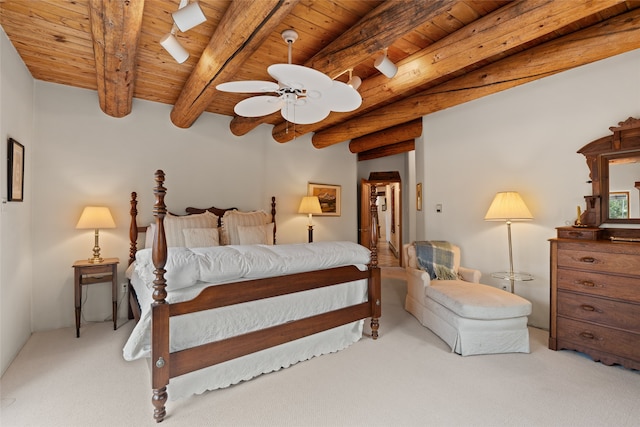 bedroom with beam ceiling, light colored carpet, ceiling fan, and wooden ceiling