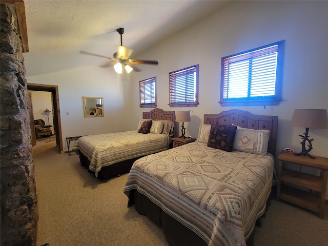 bedroom with multiple windows, ceiling fan, carpet floors, and lofted ceiling