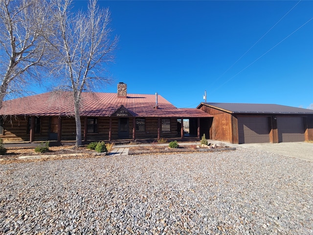 view of front facade with a porch and a garage