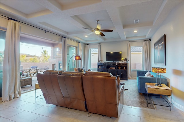 tiled living room with beam ceiling, ceiling fan, and coffered ceiling