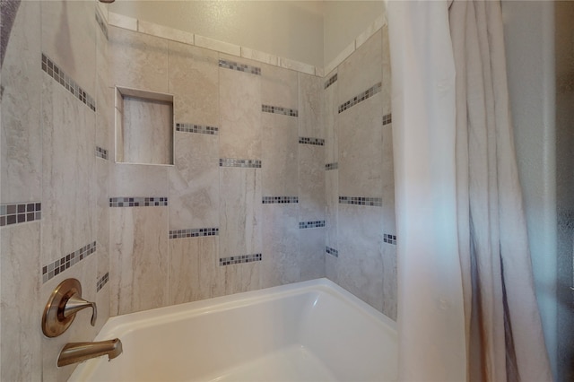 bathroom featuring shower / bath combo with shower curtain