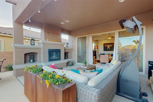 view of patio / terrace featuring an outdoor living space with a fireplace