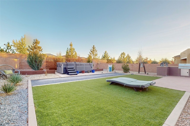 view of yard with a hot tub