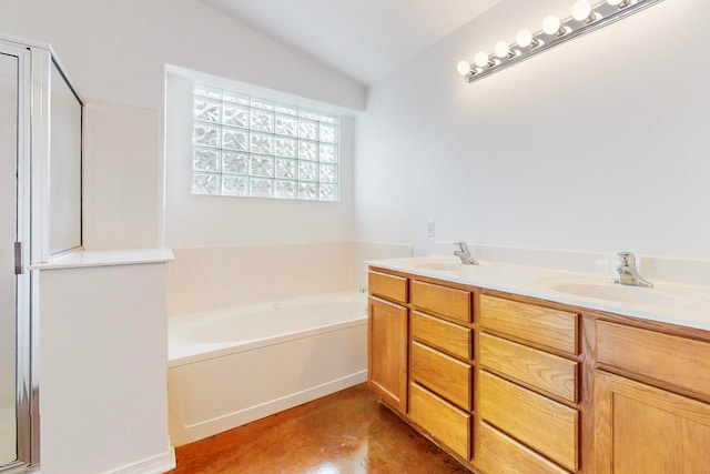 bathroom featuring plus walk in shower, vanity, and vaulted ceiling